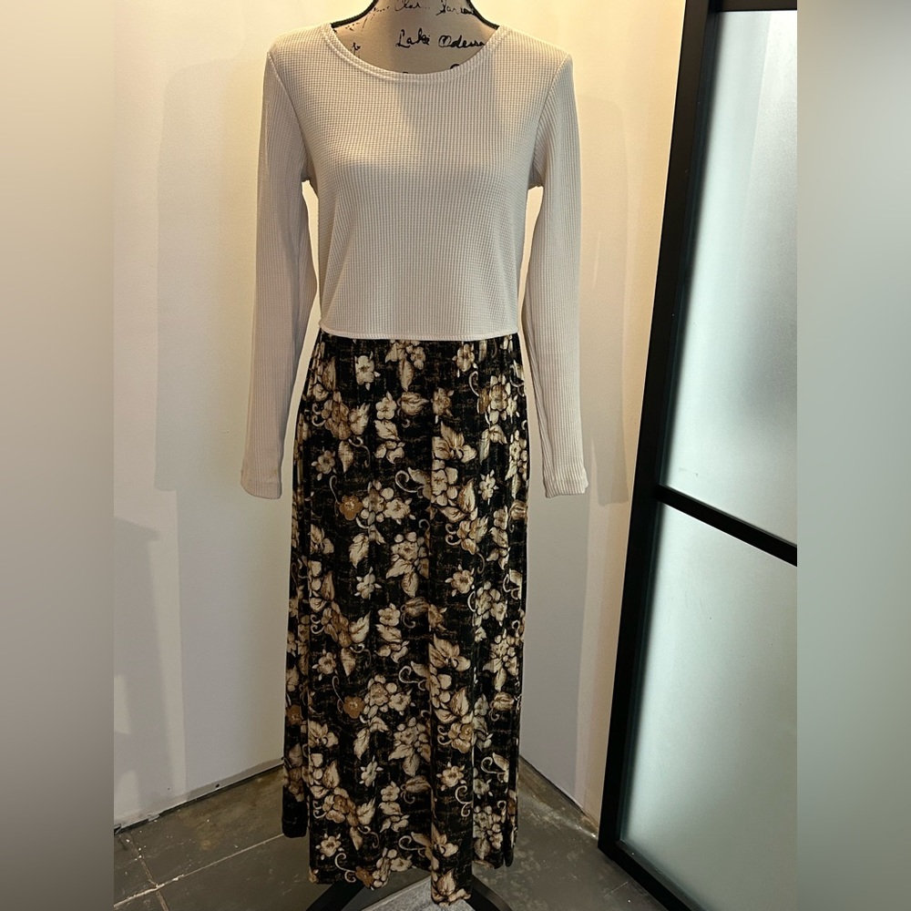 Donna Toran small cream waffle knit top and black floral skirt dress.